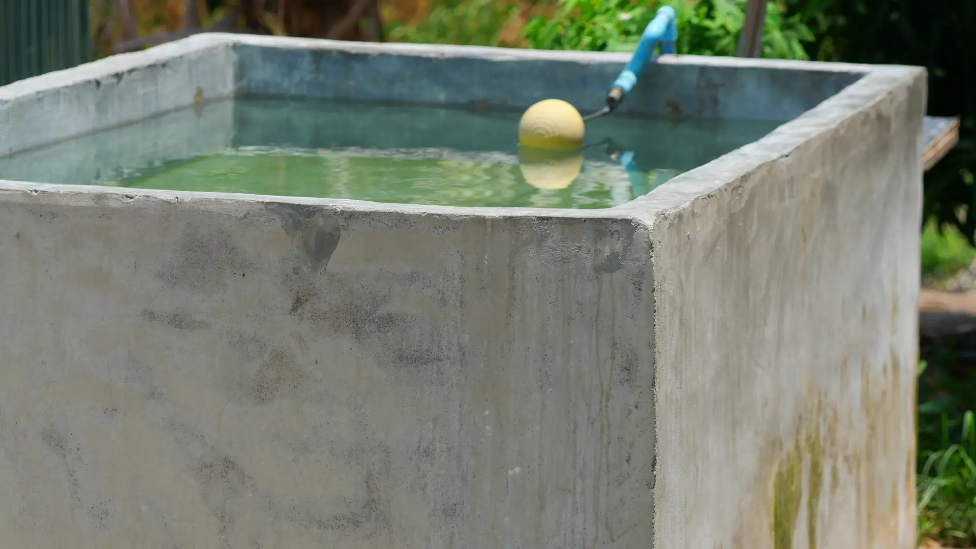 Your local water tank installation company North Shore concrete water storage tank with inlet pipe for long term water use.